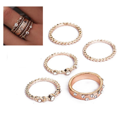 Rose gold rhinestone ring set, five oval and scalloped bands with small center stones