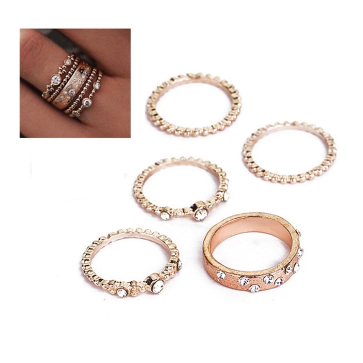 Rose gold rhinestone ring set, five oval bands with scalloped trim and center stones; inset close-up