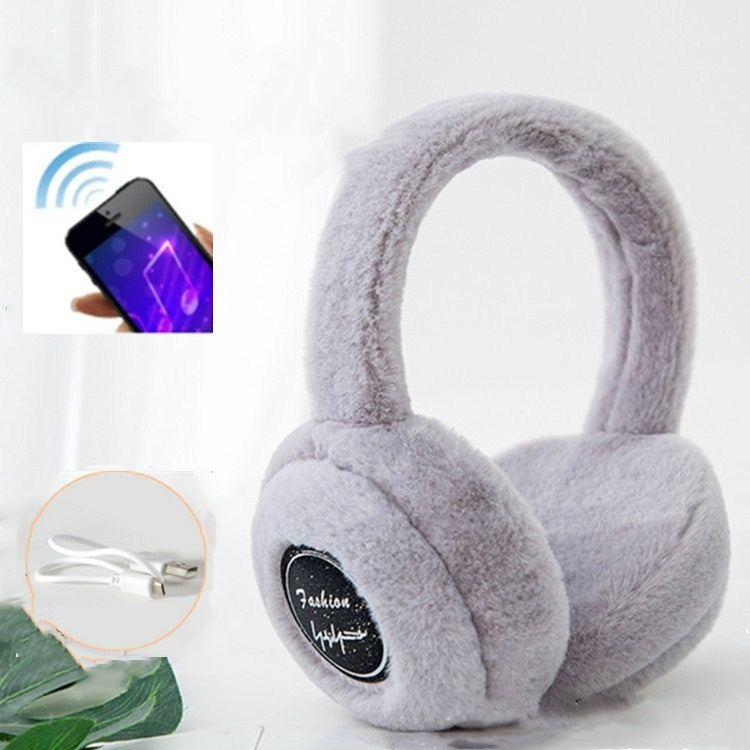 Light gray plush over-ear Bluetooth earmuffs with black control logo