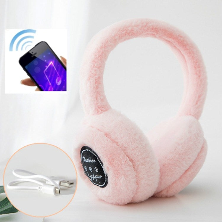 Pink plush over-ear Bluetooth earmuffs with black control label