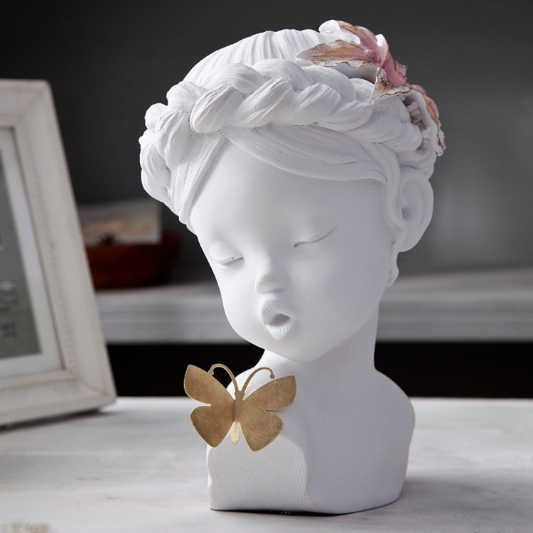 White resin bust statue with closed eyes, floral headpiece, and butterfly charm