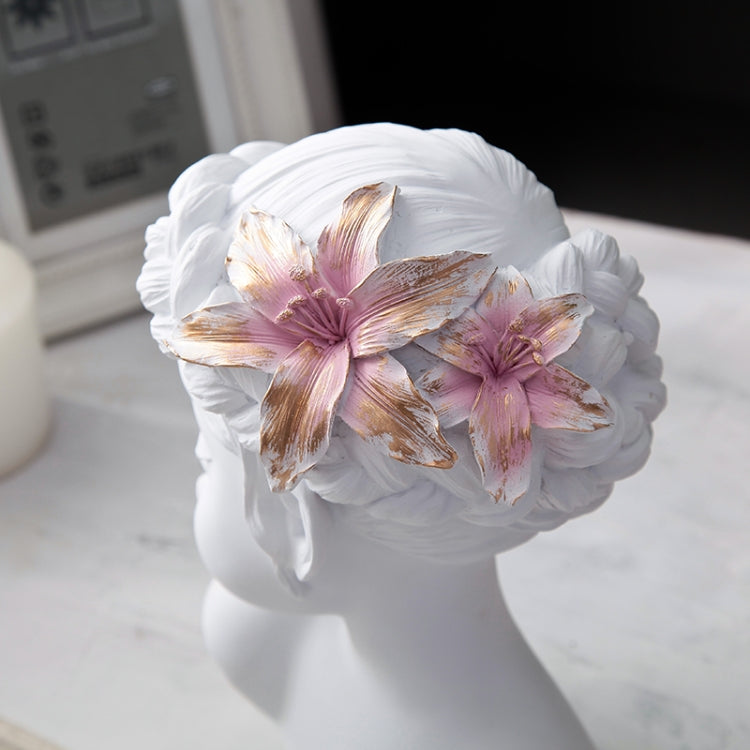 White resin bust statue head with pink and gold floral crown detail