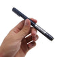 Engraver pen held in hand, showing dark barrel and fine engraving point