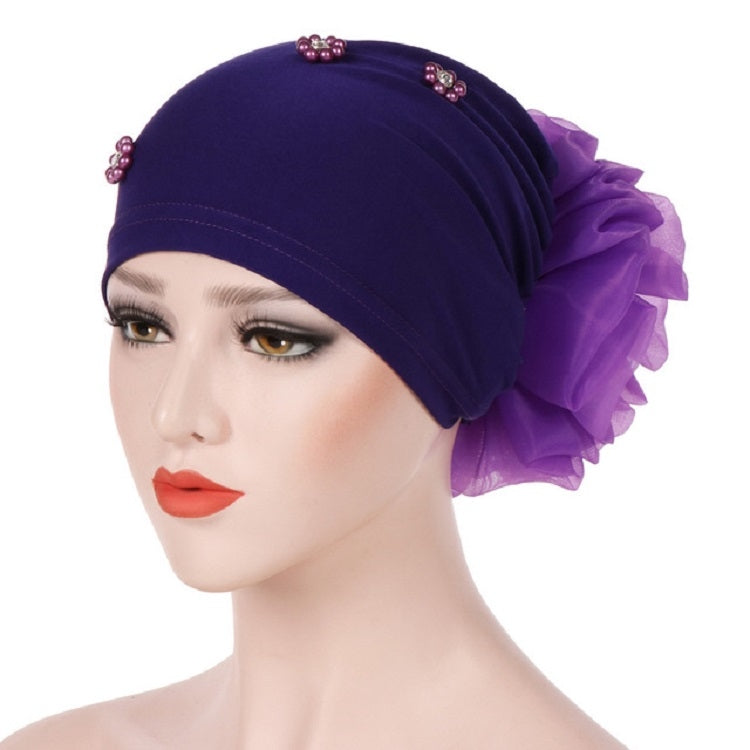 Beaded purple turban hat with side rosette flower and scattered gem accents