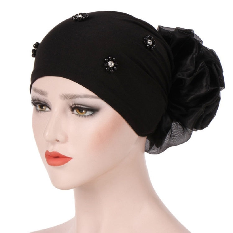 Beaded black turban hat with large side rosette flower and rhinestone detail
