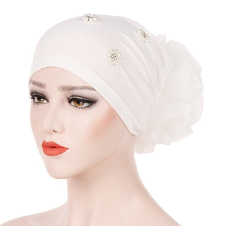 Beaded white turban hat with side rosette flower and pearl-like jeweled cluster