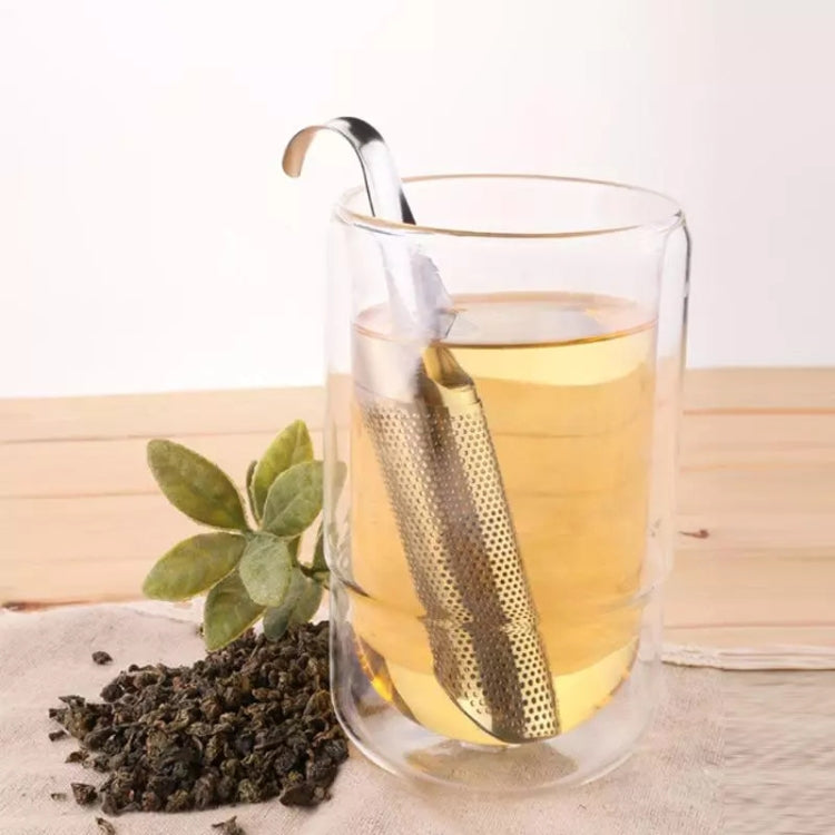 Stainless steel pipe tea strainer infusing tea in a clear glass mug