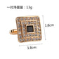 Gold-tone square cufflinks with black center and rhinestone border, front close-up