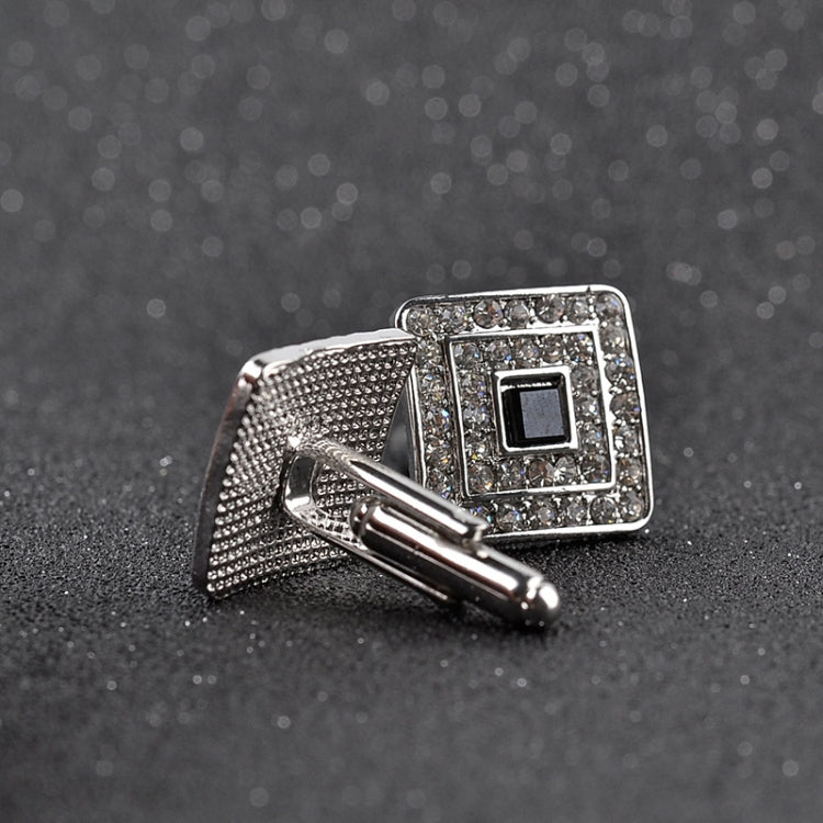 Silver-tone square cufflinks with rhinestone border, black center, on bar backing
