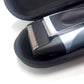 Open black zippered shaver case showing trimmer head in molded pocket