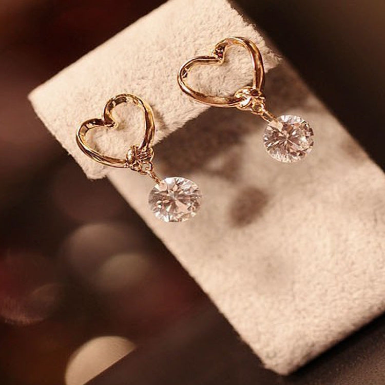 Gold heart hoop earrings with sparkling round crystal dangles