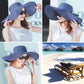 Foldable wide-brim sun hat, navy blue straw with tied bow and wide brim