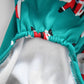 Teal holiday onesie with snowman print, elastic hem and light gray inner lining