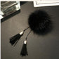 Black fur pom chain tassel brooch with black tassels and silver bead chain