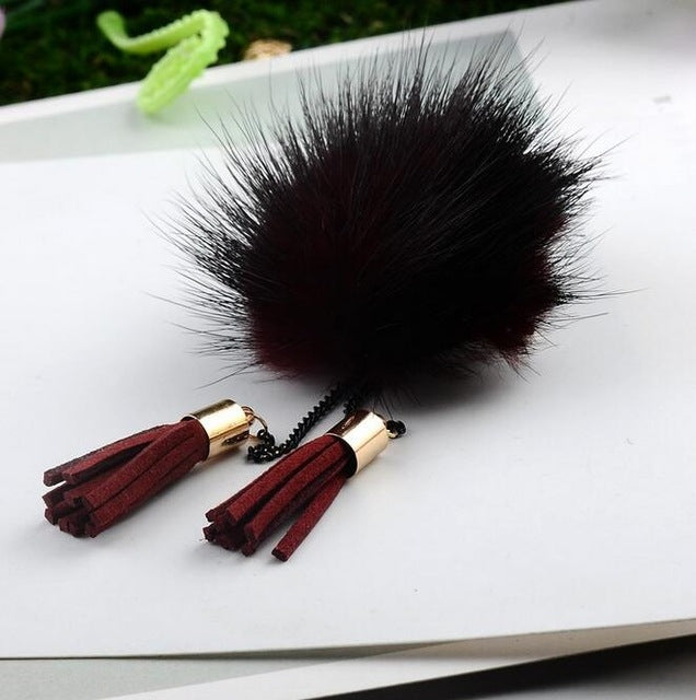 Dark burgundy fur ball chain tassel brooch with burgundy tassels and black chain