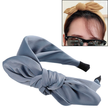 Blue cloth rabbit-ear bow headband with large knotted bow and padded headband