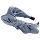 Blue fabric rabbit-ear bow headband with knotted center and long ear-like ends
