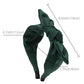 Green fabric rabbit-ear bow headband with knotted center, product size diagram