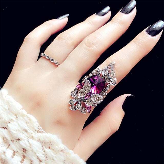 Purple gemstone butterfly statement ring set, with thin crystal band on hand