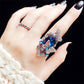 Blue butterfly crystal statement ring with thin band on hand