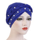 Women’s turban cap in royal blue with woven braid and white pearl bead trim