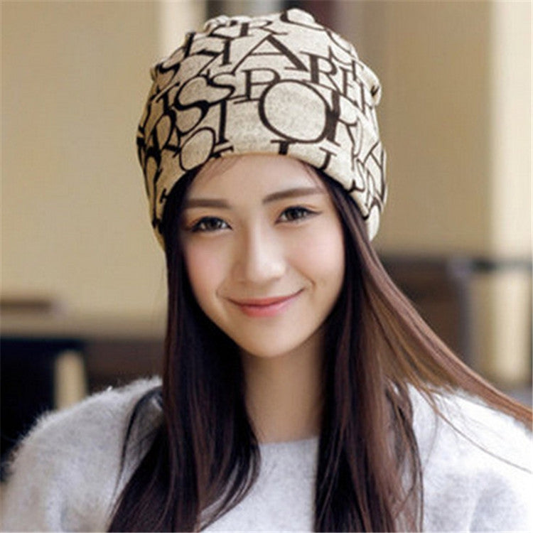 Women’s letter-print turban cap, beige with black graphic pattern, front view