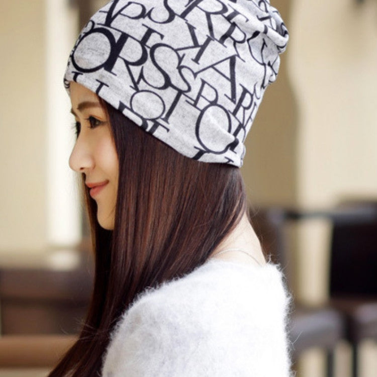 Women’s letter-print turban cap, beige with black letters, side profile