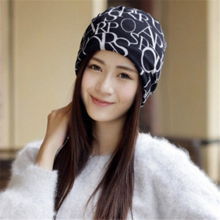Women’s letter-print turban cap, black with white letters, front view