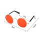 Pet sunglasses with orange reflective round lenses, rose-gold frame, and black stems