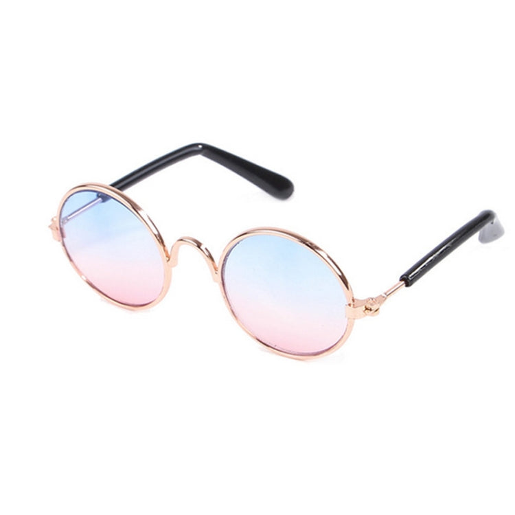 Round pet sunglasses with light pink reflective lenses, rose-gold frame, black stems