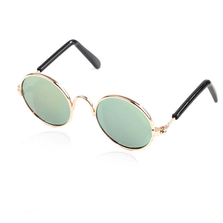 Pet sunglasses with round green tinted lenses and rose-gold metal frames
