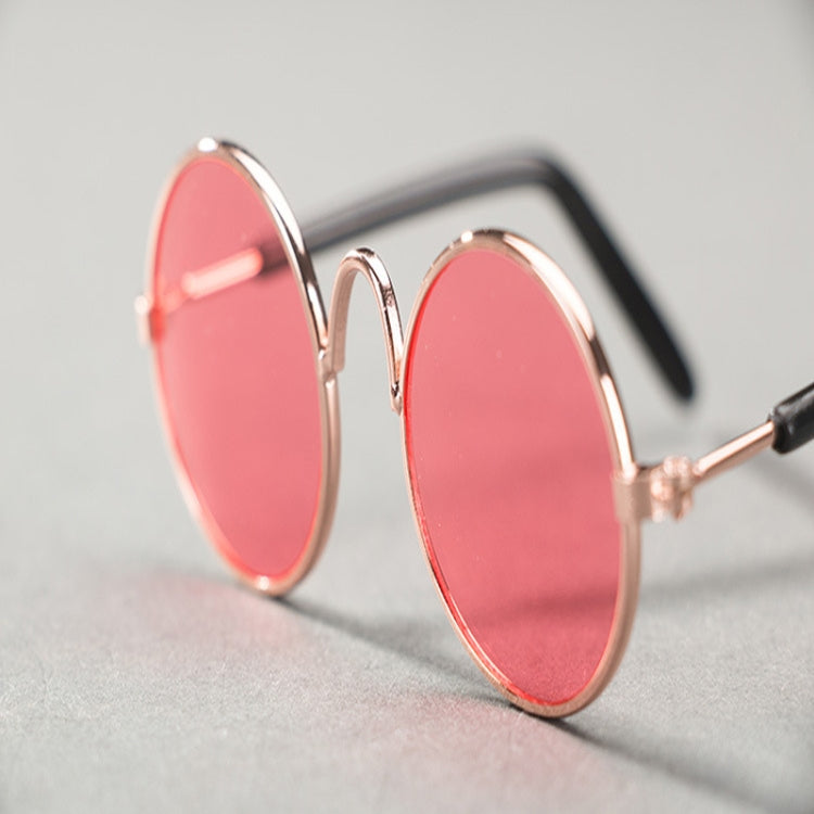 Pet sunglasses with round pink tinted lenses and rose-gold metal frames