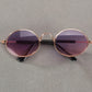 Pet sunglasses with round purple tinted lenses and rose-gold metal frames