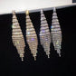 Two-color rhinestone tassel clip earrings in gold and silver, long drape with tiered stones