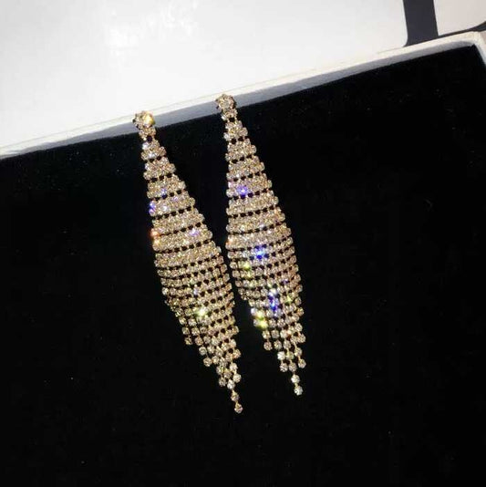 Two-color rhinestone tassel clip earrings in gold, long drape design with sparkling tiers