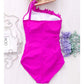 Fuchsia one-piece swimsuit with one-shoulder halter strap, hanging with ruffled neckline