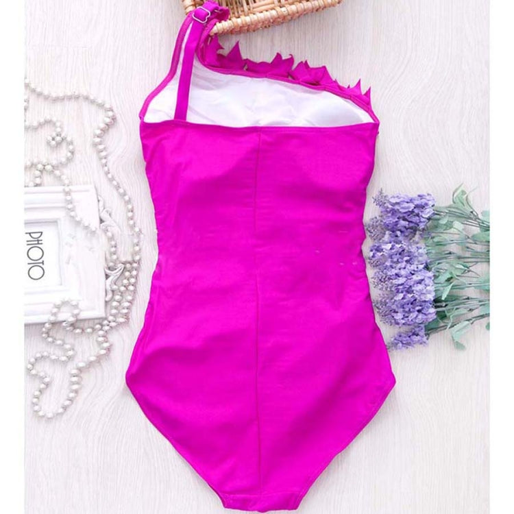 Fuchsia one-piece swimsuit with one-shoulder halter strap, hanging with ruffled neckline