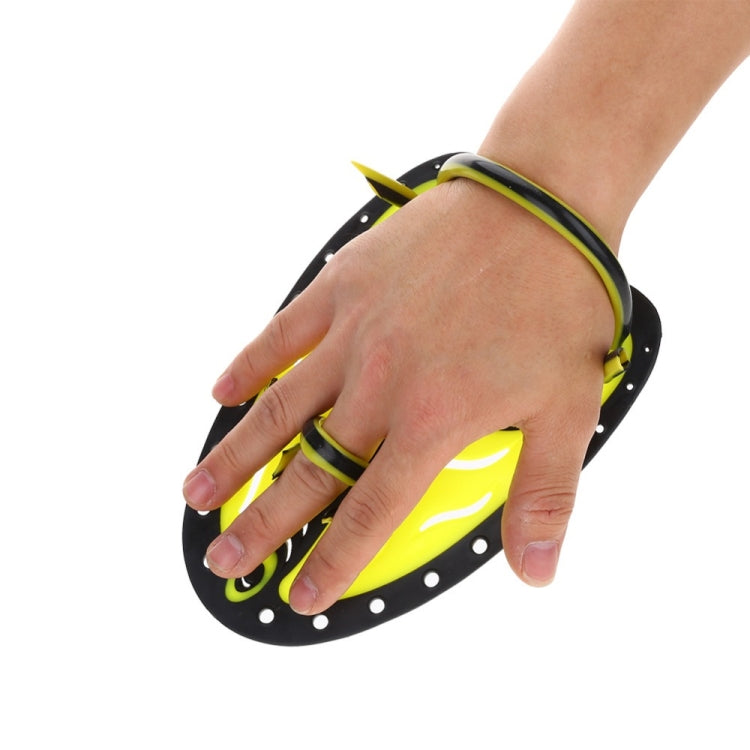 Neon yellow and black hand webbed swim glove on hand with wrist strap visible