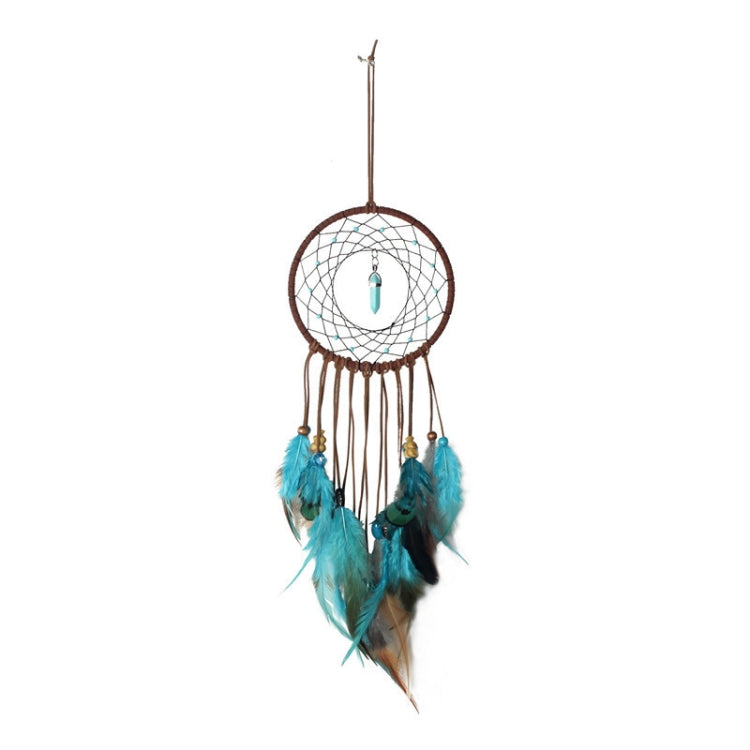 Dreamcatcher wall hanging with white web, brown hoop, turquoise feathers, teal charm