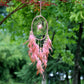 Pink dreamcatcher ornament with round web hoop, beaded drops, and feather fringe.
