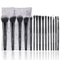 Makeup brush set with soft black bristles, black handles, and gray fabric storage pouch