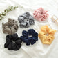 Set of 6 fabric scrunchie hair ties in assorted colors with large ruffled swirls
