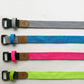 Set of yoga resistance bands in gray, blue, pink, and lime with metal buckles