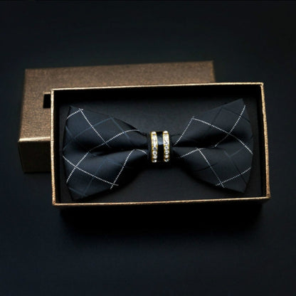 Men's bow tie with dark grid pattern, center metal bar accent, in gift box