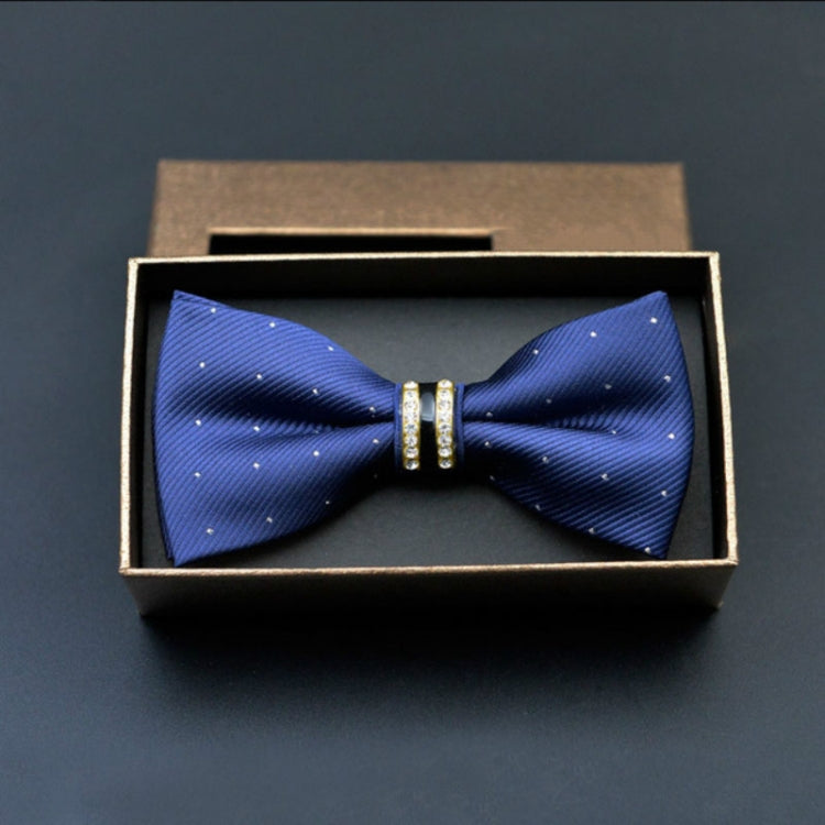 Blue bow tie with small white dots and gold-tone metal bar center, in gift box