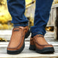 Brown suede sneakers with side panel stitching and thick treaded outsole