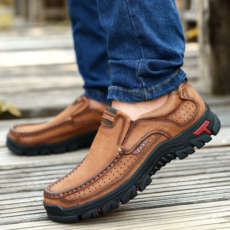 Brown suede hiking shoe with perforations, pull tab, and chunky traction sole