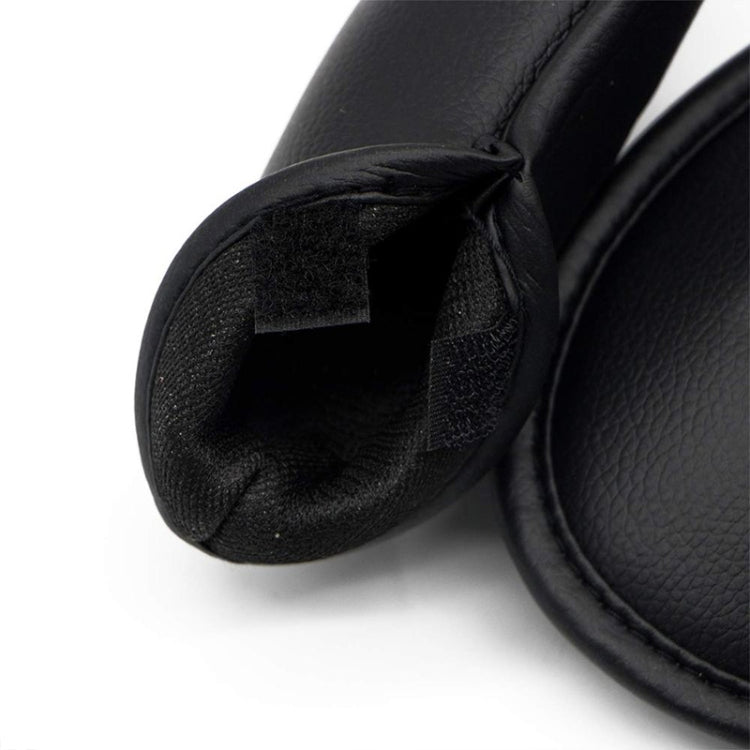 Black textured golf club head cover with open mouth and lined interior.