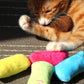 Colorful plush catnip chew toy set, with bright blue, pink, green, and yellow pieces
