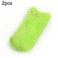 Green plush catnip chew toy shaped like a cat paw, embroidered smiling face